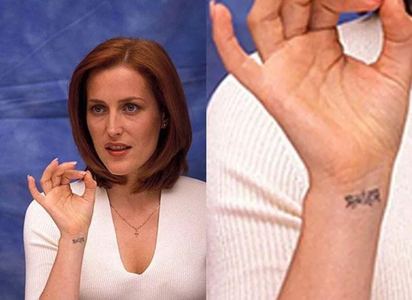 Gillian Anderson has An unknown word in Hindi is tattooed on her wrist.