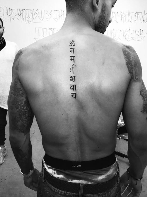Theo Walcott got 'Om Namah Shivay' tattooed on his back.